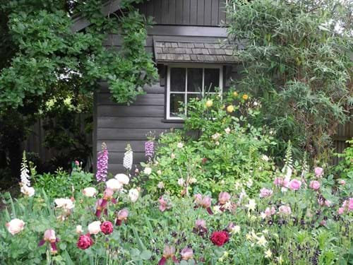 Landscape Design Melbourne | Sandra McMahon Gardenscape Design | We design sympathetic structures for the garden. Here a shed built entirely of recycled material sits timelessly in a perfect setting.